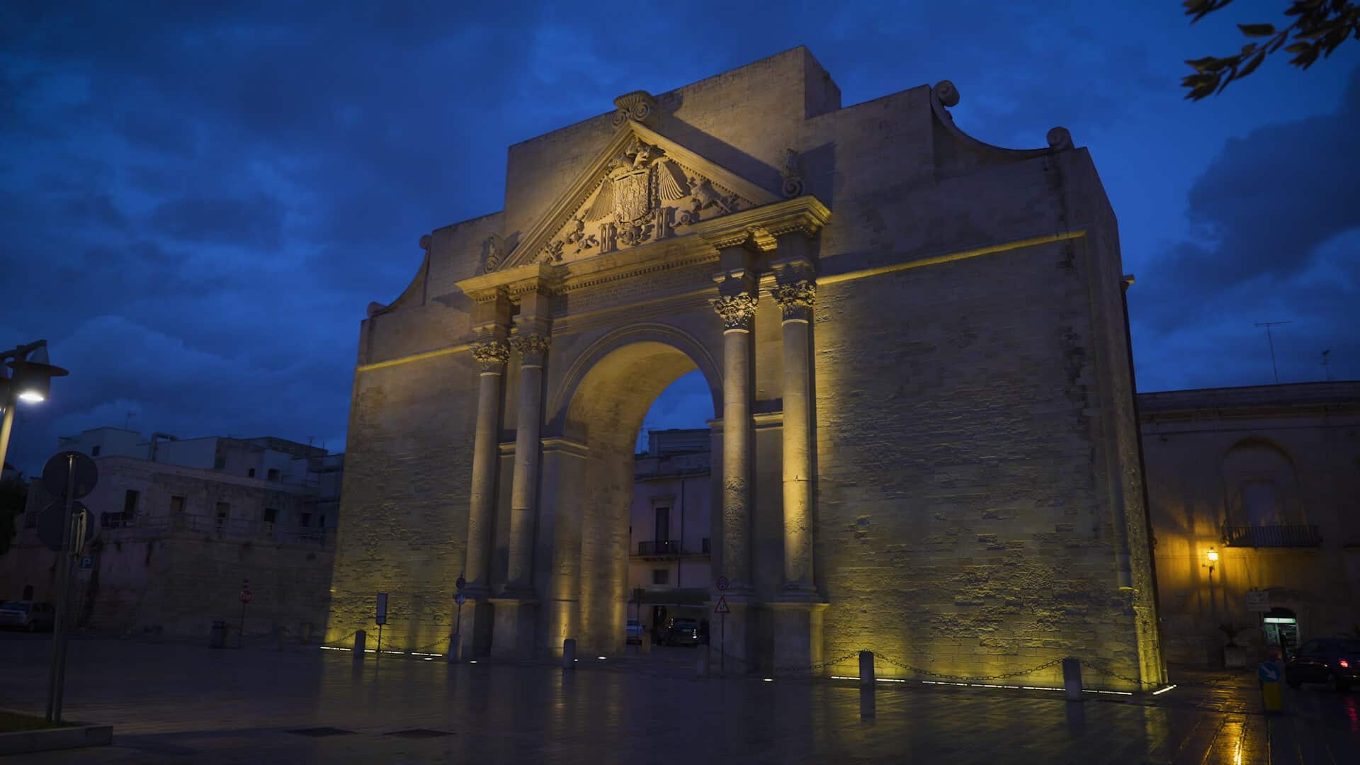 City gate of Lecce Italy at night.