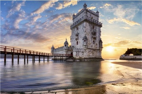A castle on the sea in Portugal at sunset.