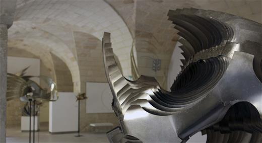 Modern metal sculpture in an ancient Italian museum.