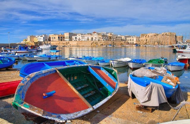 Colorful boats in the harbor of Gallipoli Italy