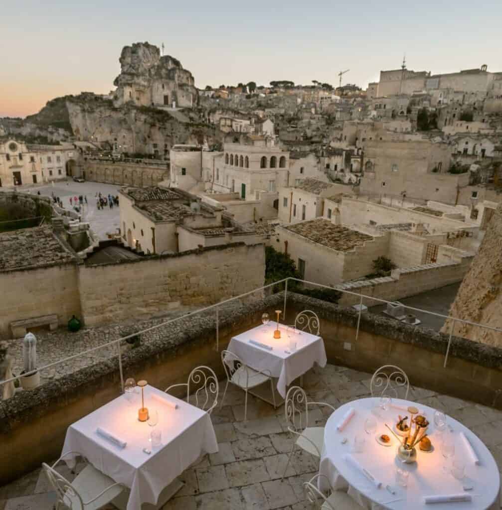 Outdoor dining tables at Sant'Angelo Luxury Resort in Matera Italy.