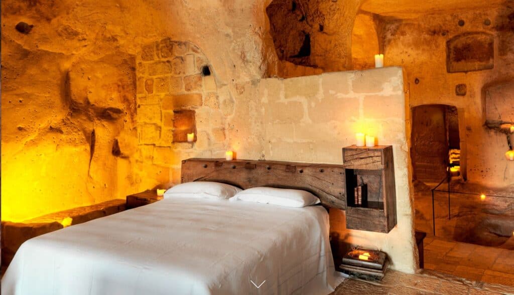 Bedroom in Sextantio Le Grotte della Civita, a luxury hotel in Matera Italy.