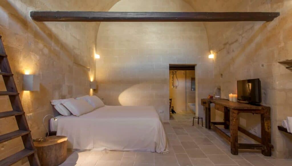 Bedroom in Corte San Pietro, a luxury hotel in Matera Italy.