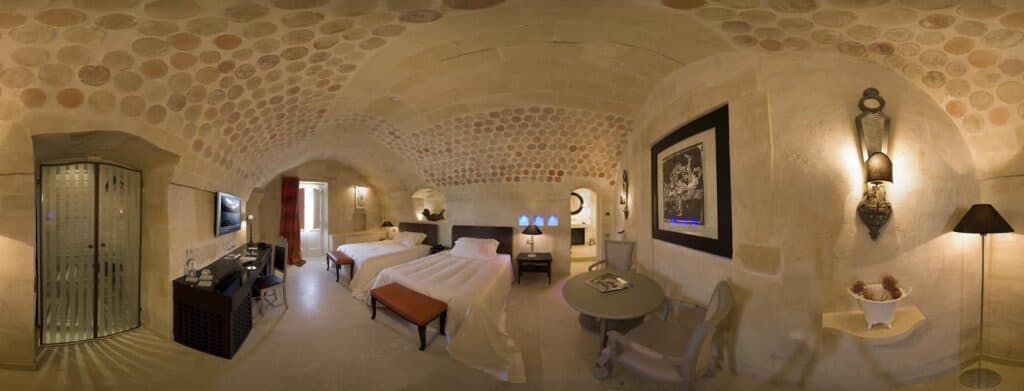 Bedroom in Palazzo Gattini, a luxury hotel in Matera Italy.