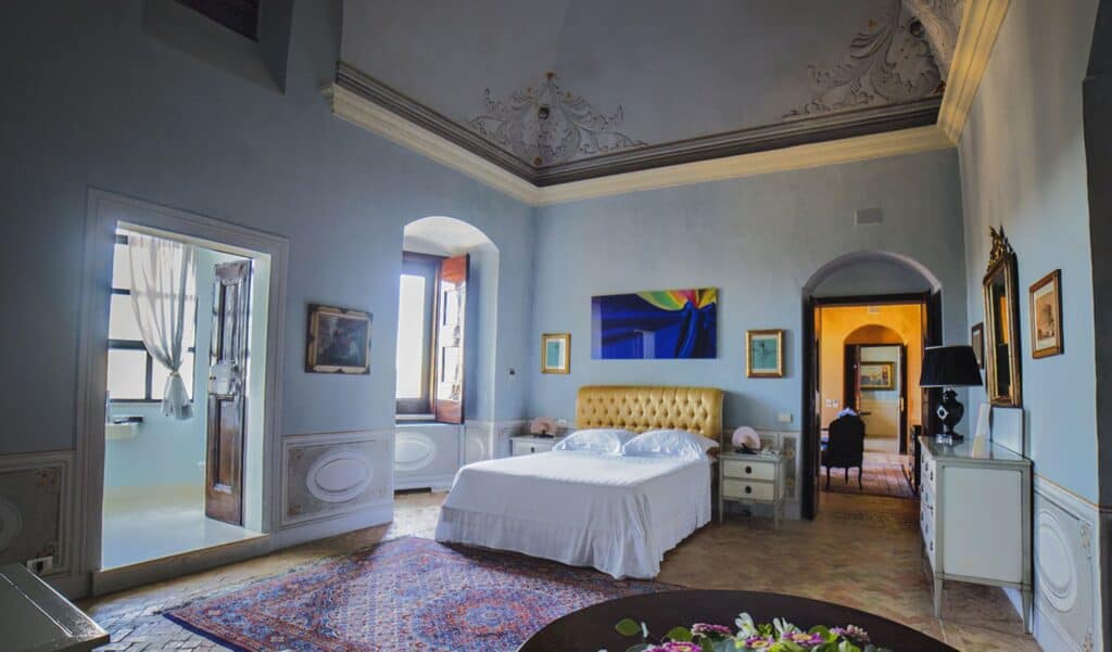 Bedroom inHotel Palazzo Viceconte, a luxury hotel in Matera Italy.