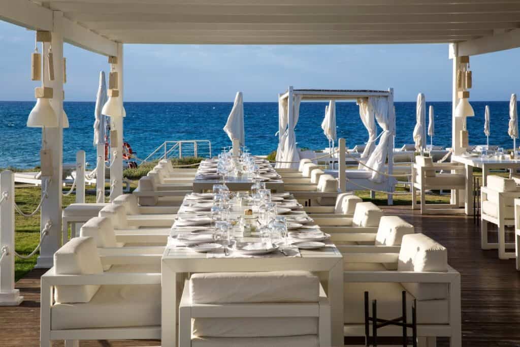 White tableclothed seaside restaurant at Borgo Egnazia.